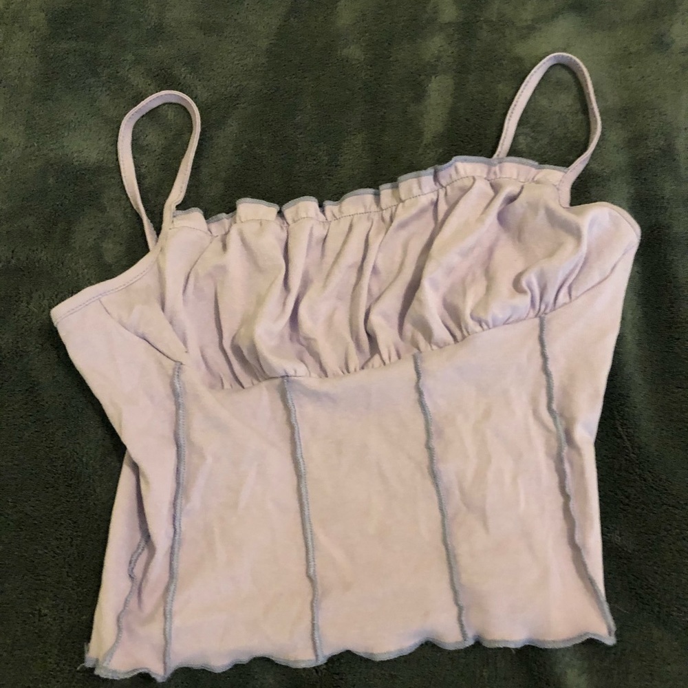 a purple ruffle tank top